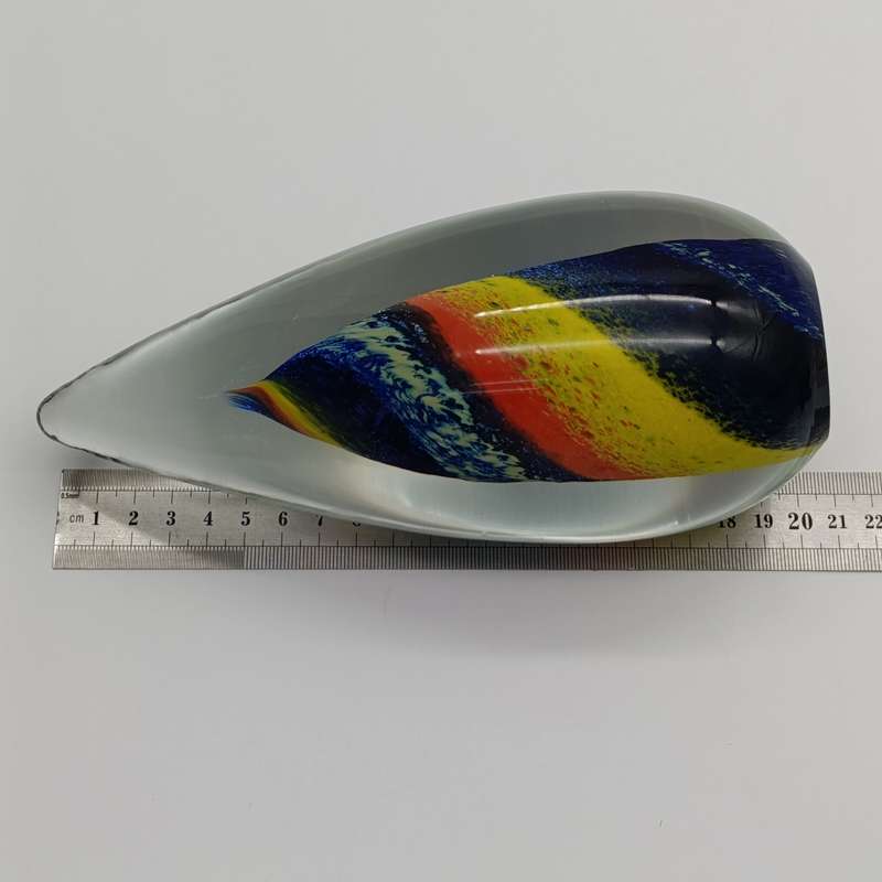 Vintage glass paperweight with colourful spiral