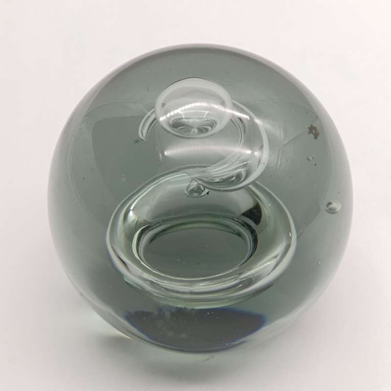 Vintage glass paperweight with water drop design inside