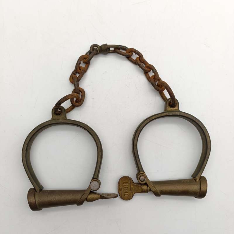 Set of antique brass orbit fetters (cuffs for feet) leg irons