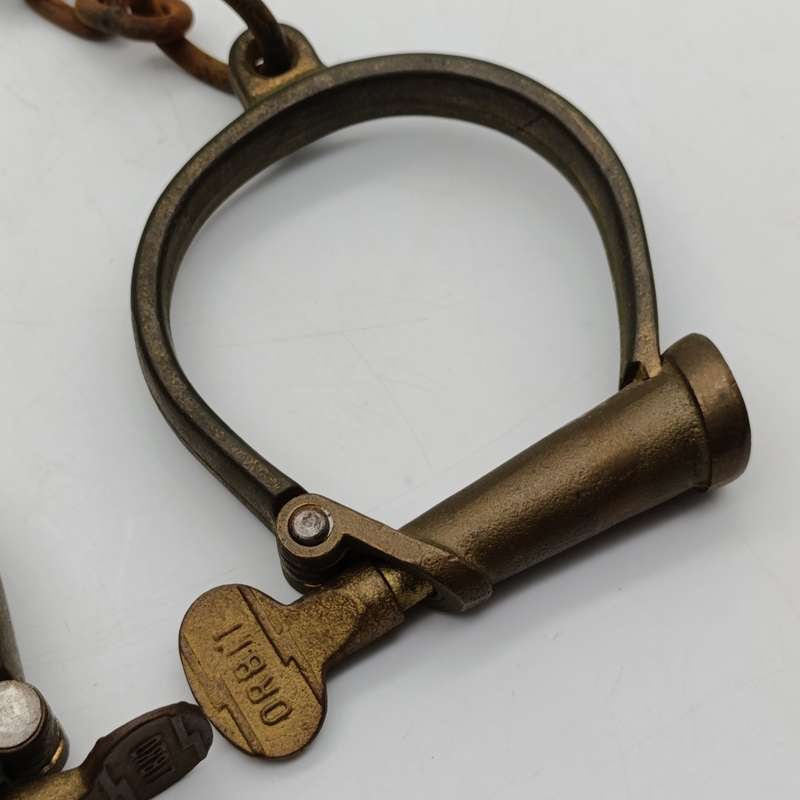Set of antique brass orbit fetters (cuffs for feet) leg irons