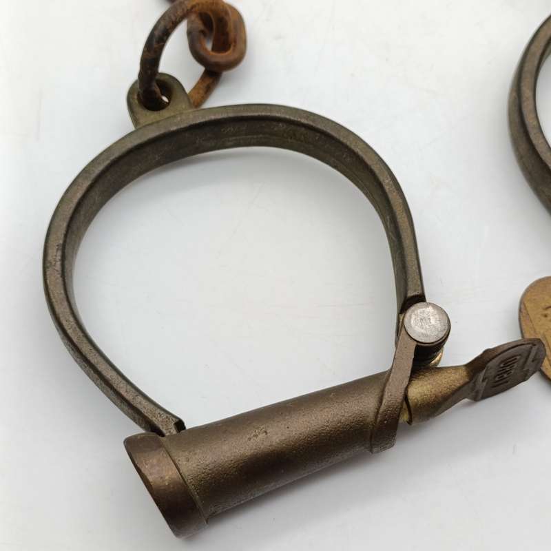 Set of antique brass orbit fetters (cuffs for feet) leg irons