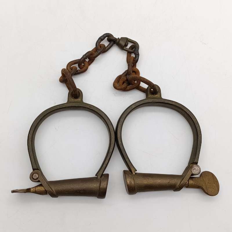 Set of antique brass orbit fetters (cuffs for feet) leg irons
