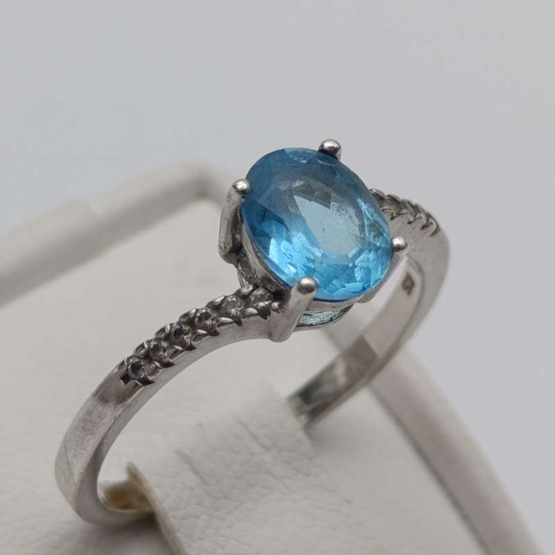 Sterling silver ring with blue Topaz and white sapphires