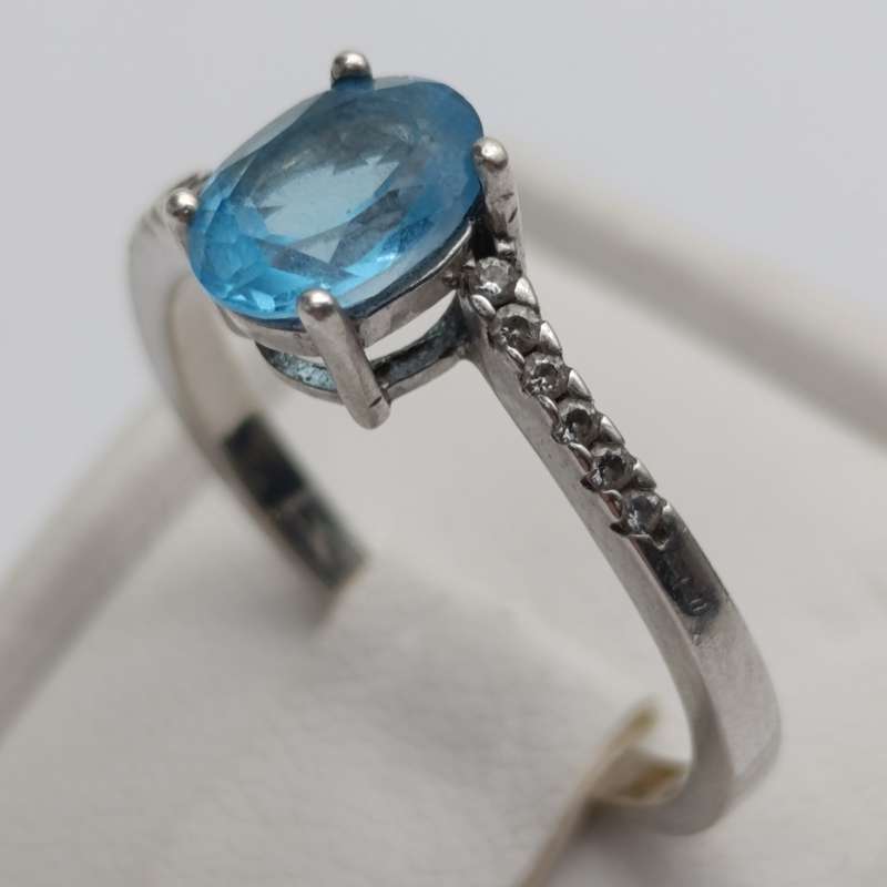 Sterling silver ring with blue Topaz and white sapphires