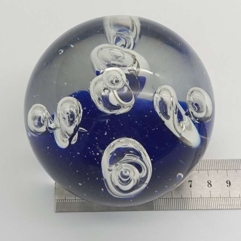 Vintage glass Paperweight with halo and drop designs inside