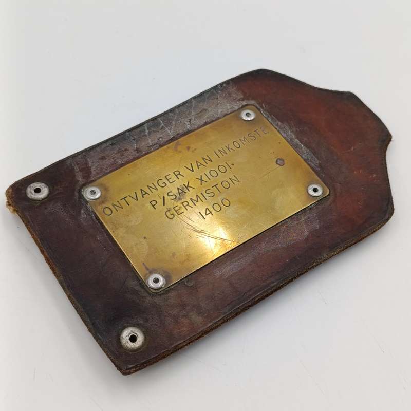 Leather postal tag between Posmeester Germiston and Ontvanger van inkomste