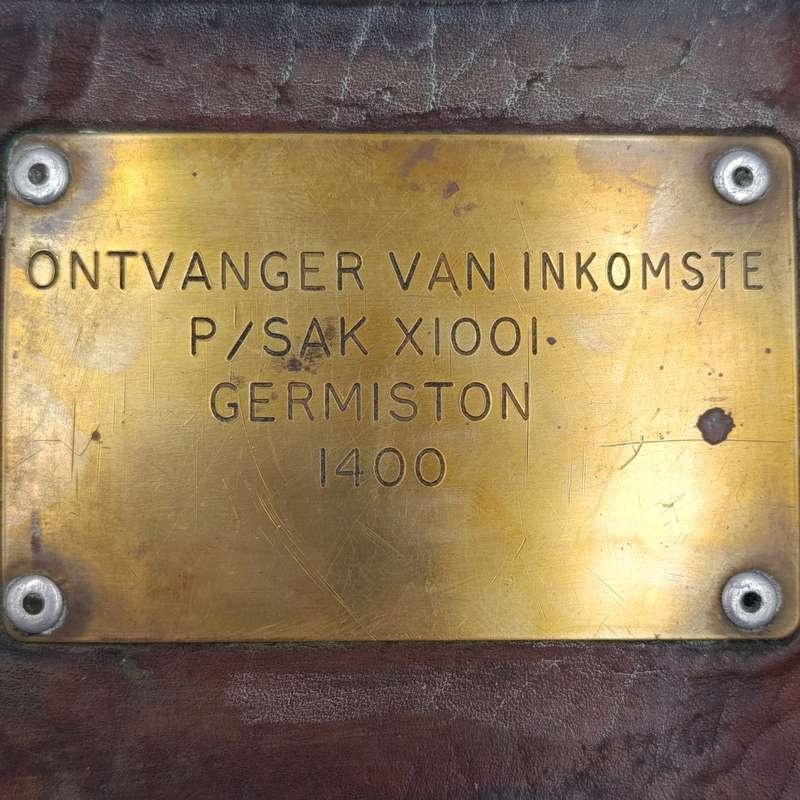 Leather postal tag between Posmeester Germiston and Ontvanger van inkomste