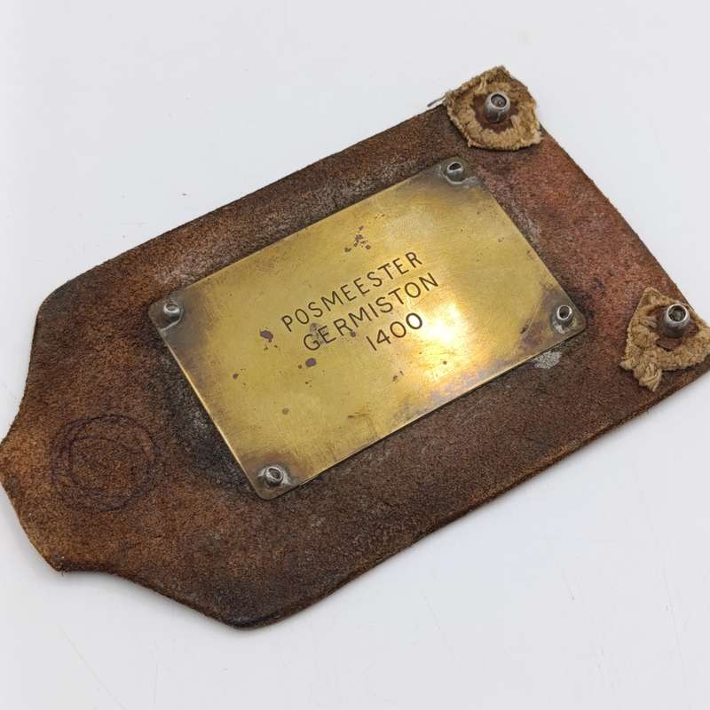 Leather postal tag between Posmeester Germiston and Ontvanger van inkomste