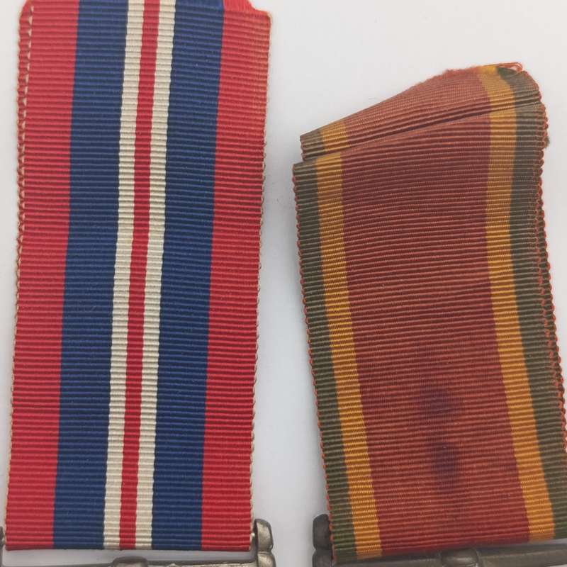 Pair of WW2 medals issued to 214152 C.J. maker