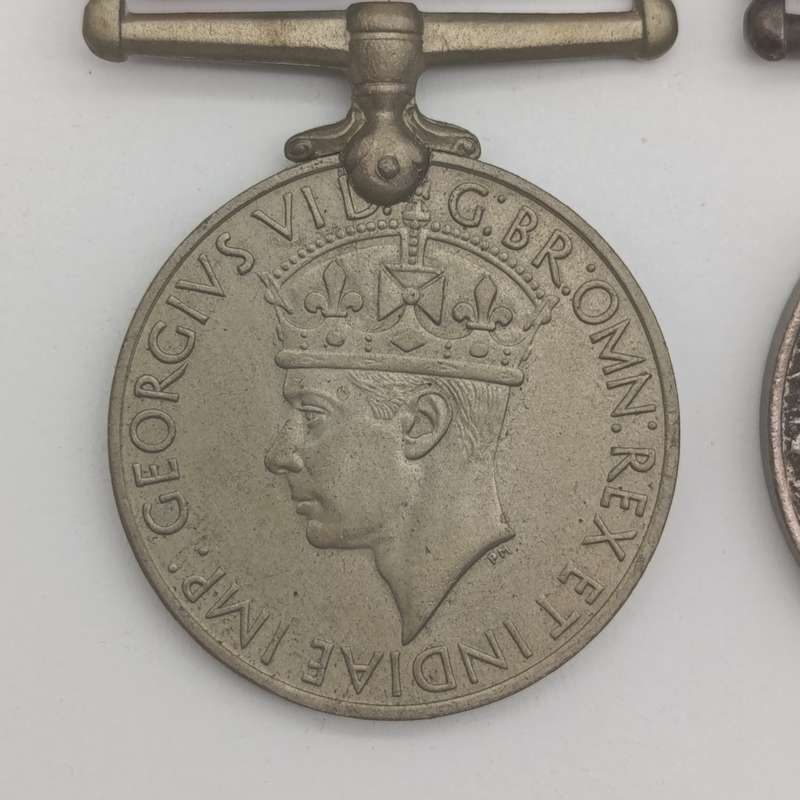 Pair of WW2 medals issued to 214152 C.J. maker