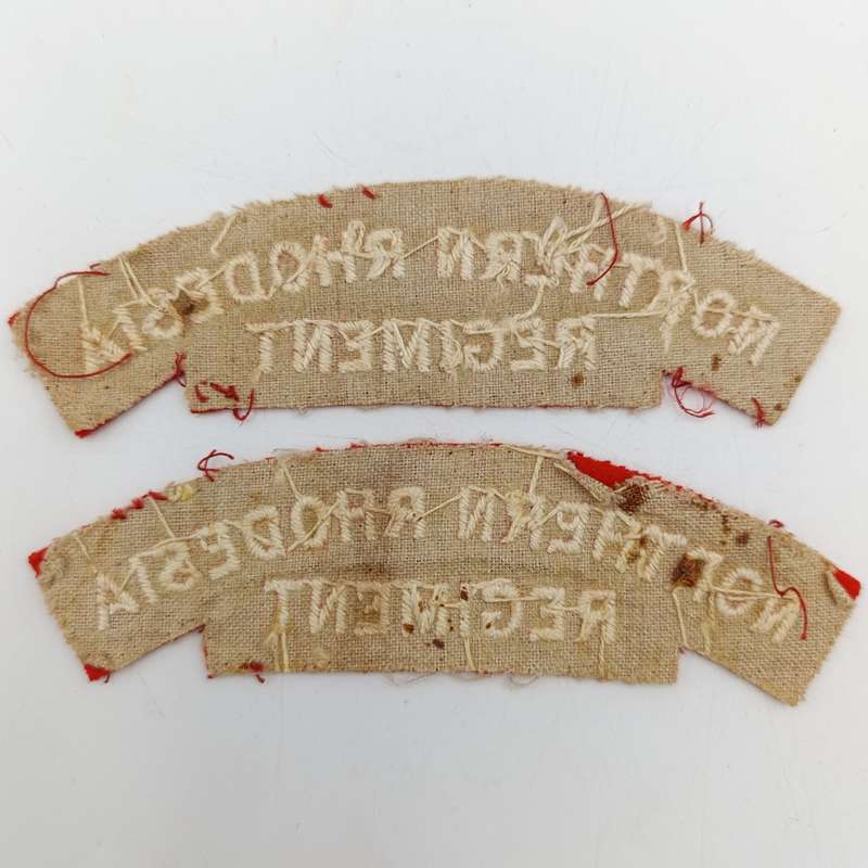 Pair of Northern Rhodesia regiment cloth shoulder titles