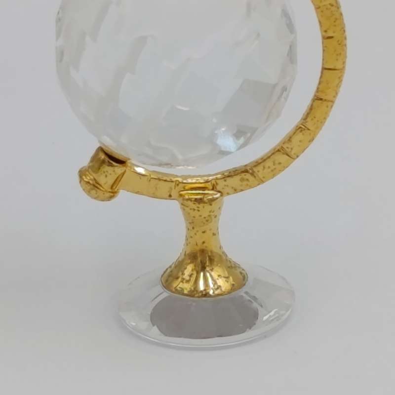 Swarovski crystal memories world globe ornament in box - small chip in South America