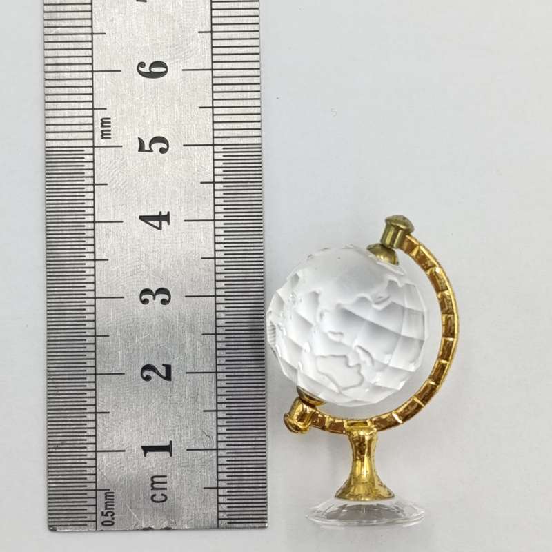 Swarovski crystal memories world globe ornament in box - small chip in South America