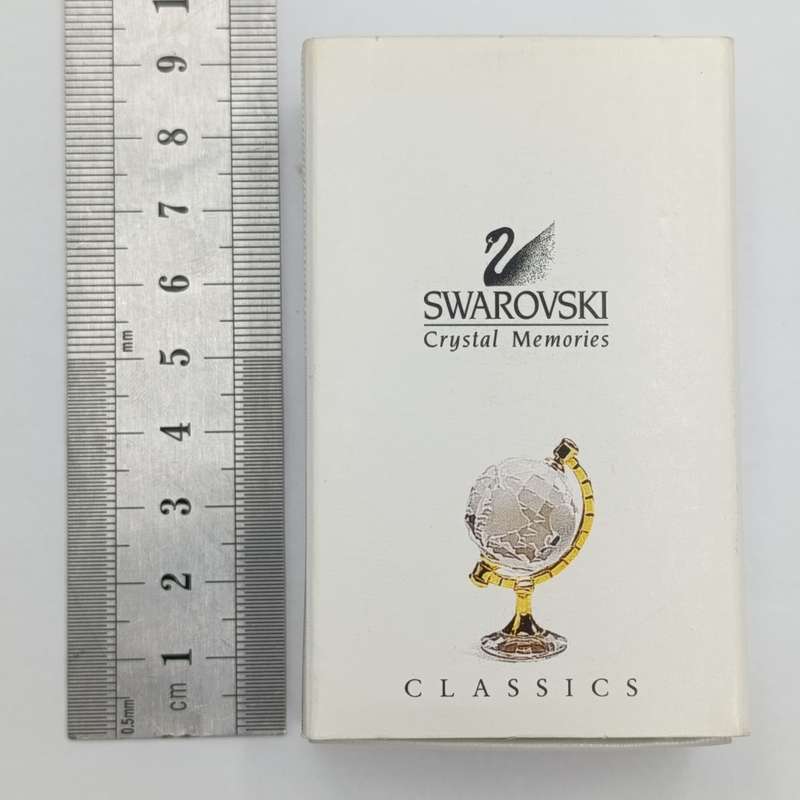 Swarovski crystal memories world globe ornament in box - small chip in South America