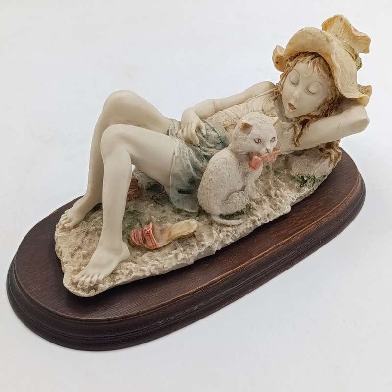 Vintage polyresin sculpture of sleepy girl with cat