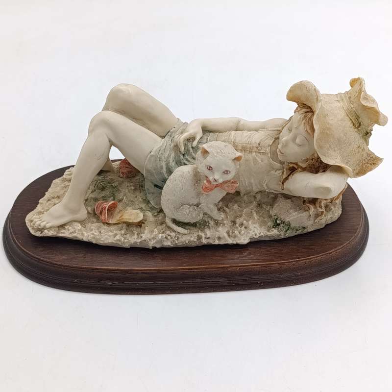Vintage polyresin sculpture of sleepy girl with cat