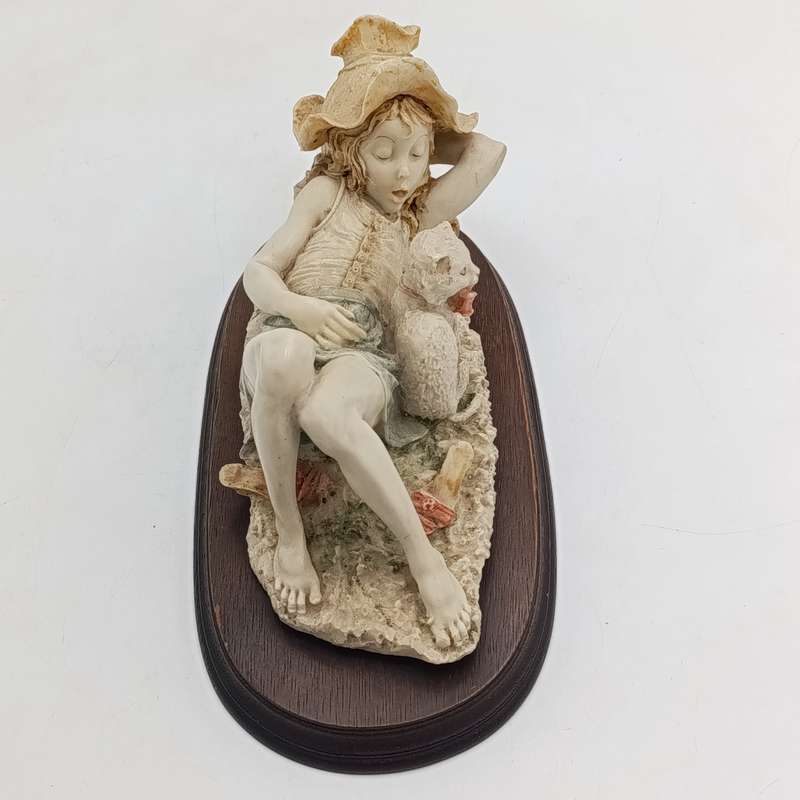 Vintage polyresin sculpture of sleepy girl with cat