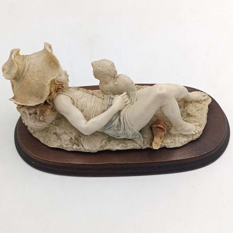 Vintage polyresin sculpture of sleepy girl with cat