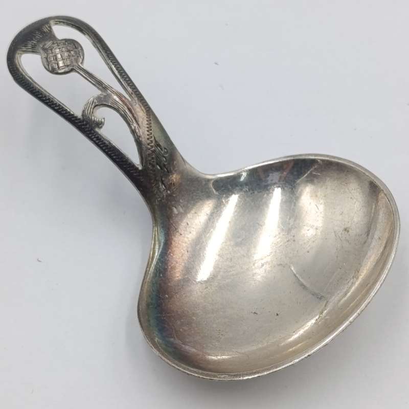 Antique Scottish silverplated tea caddy spoon with thistle design