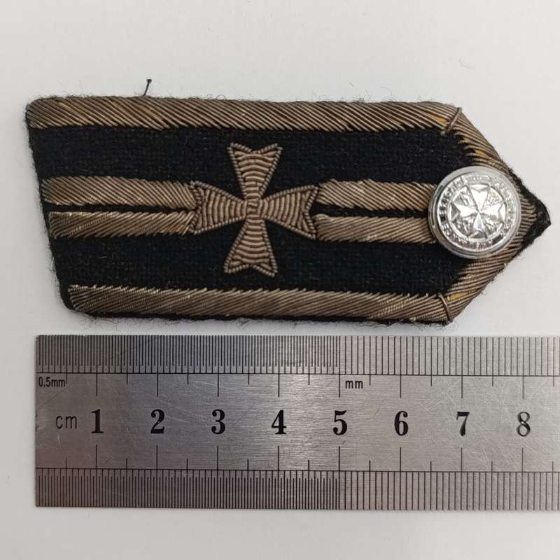 Collection of vintage St. John Ambulance badges and insignia