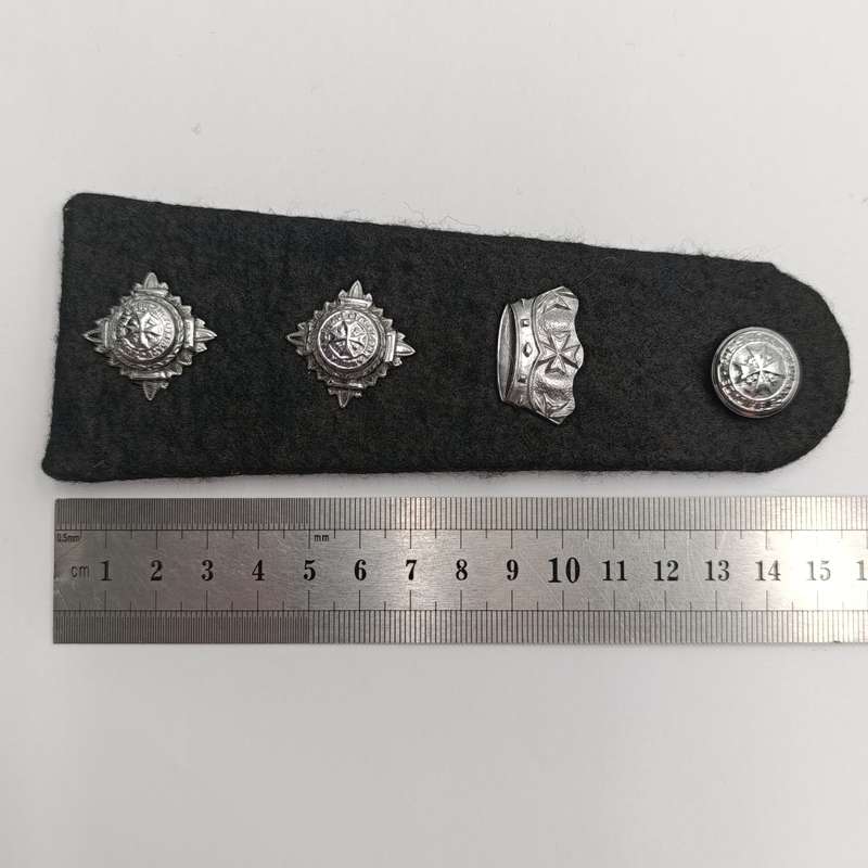 Collection of vintage St. John Ambulance badges and insignia