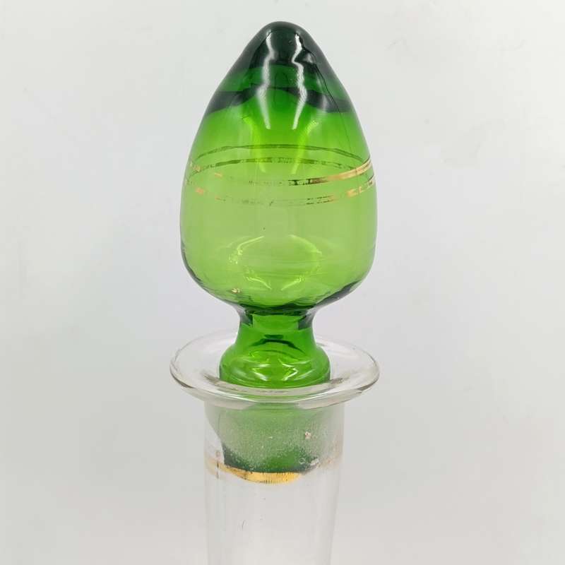Beautiful vintage glass decanter with green glass top