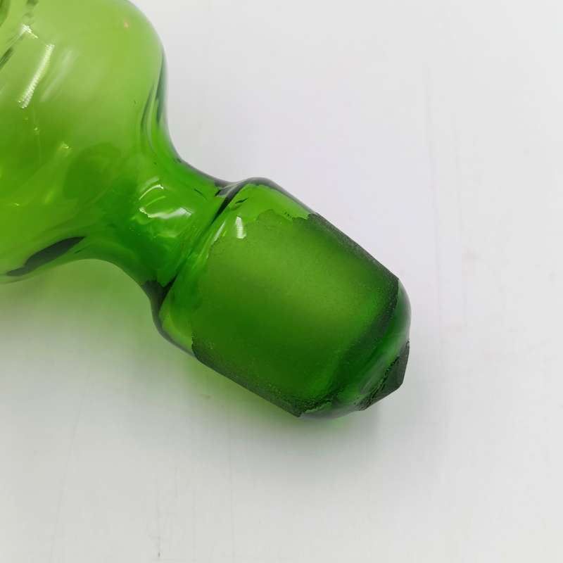 Beautiful vintage glass decanter with green glass top