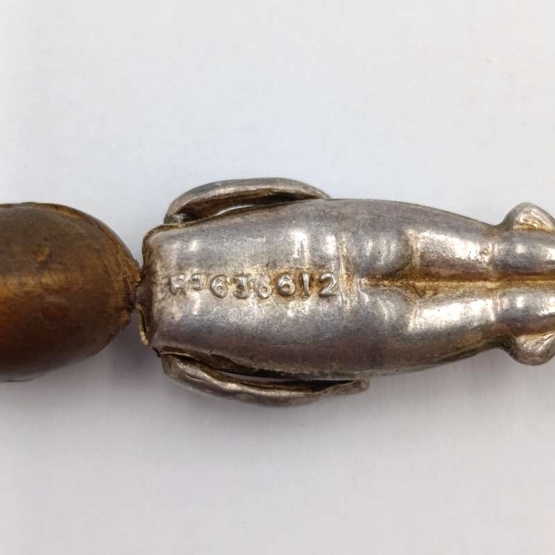 WW1 period Fumsup metal and wood charm