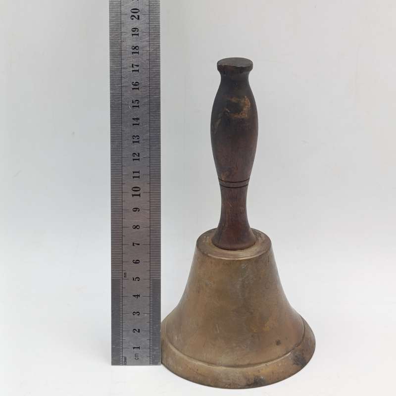 Vintage brass hand bell with wooden handle