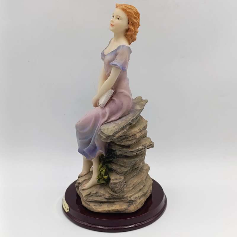 Beautiful Angelica Collection poly resin figurine of girl with book
