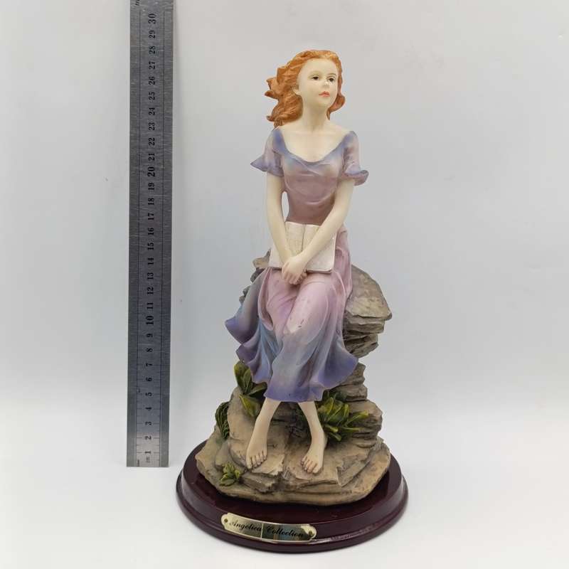 Beautiful Angelica Collection poly resin figurine of girl with book