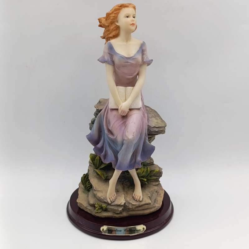 Beautiful Angelica Collection poly resin figurine of girl with book