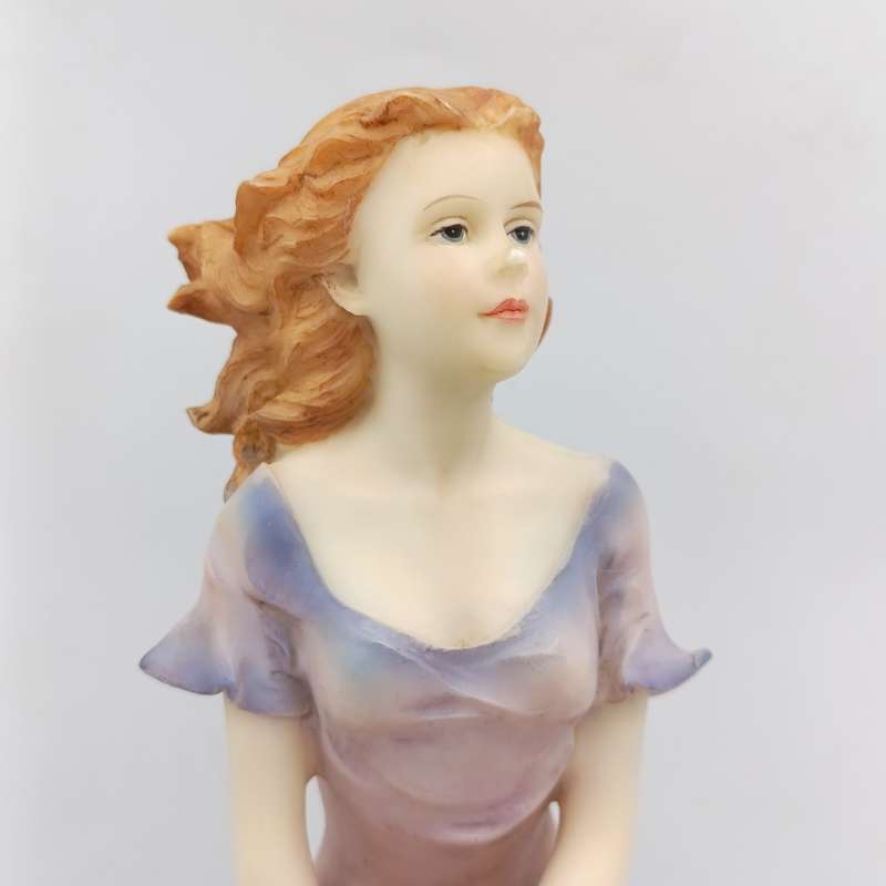 Beautiful Angelica Collection poly resin figurine of girl with book