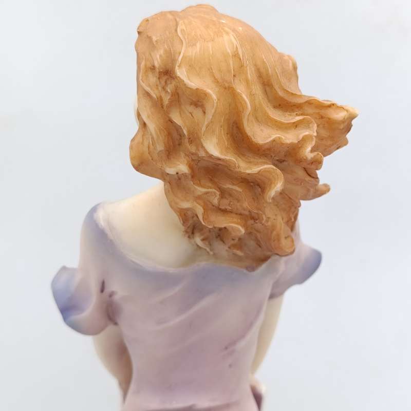 Beautiful Angelica Collection poly resin figurine of girl with book