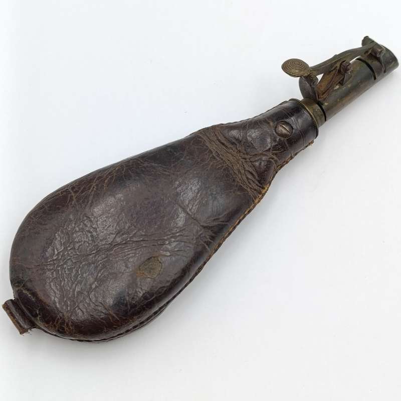 Antique musket ball pouch with brass applicator
