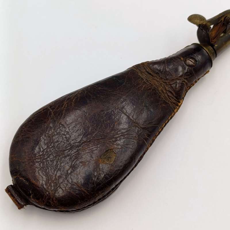 Antique musket ball pouch with brass applicator