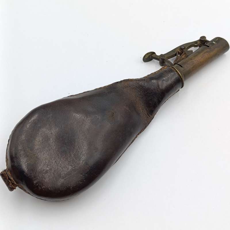 Antique musket ball pouch with brass applicator