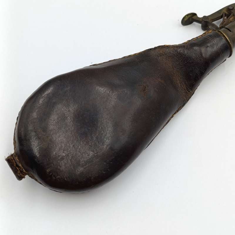 Antique musket ball pouch with brass applicator