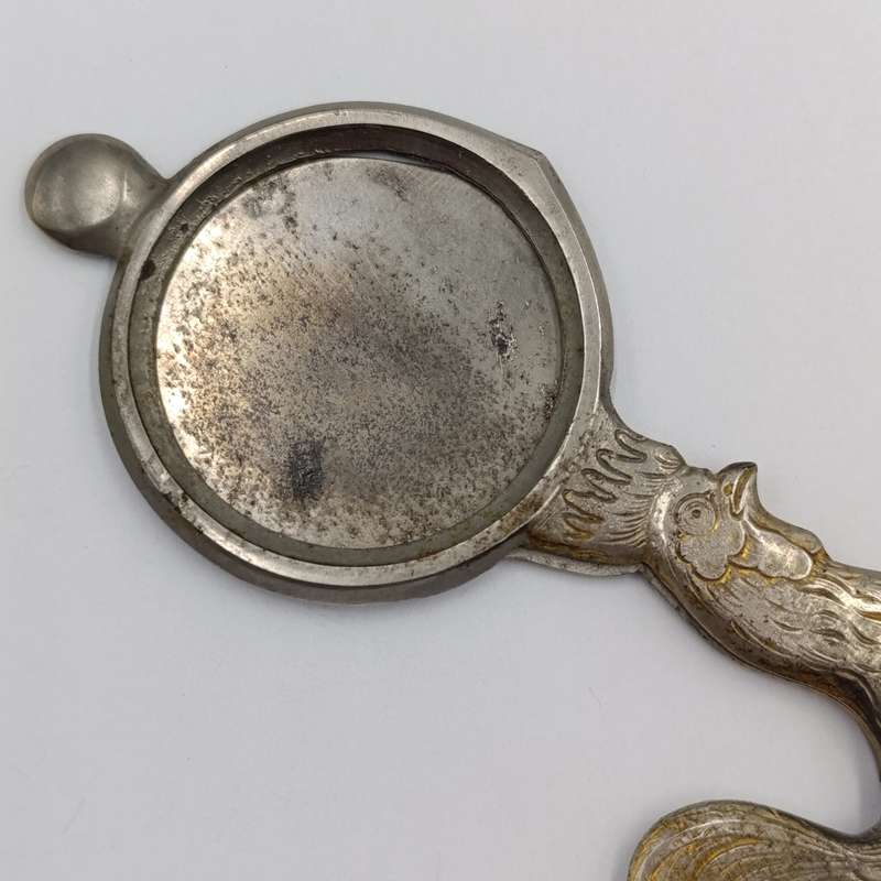 Vintage candle snuffer with rooster