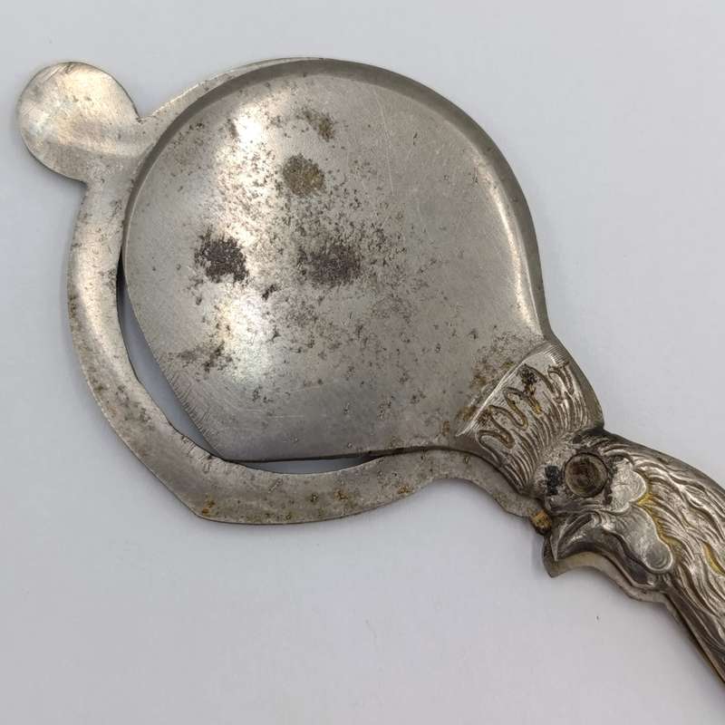 Vintage candle snuffer with rooster