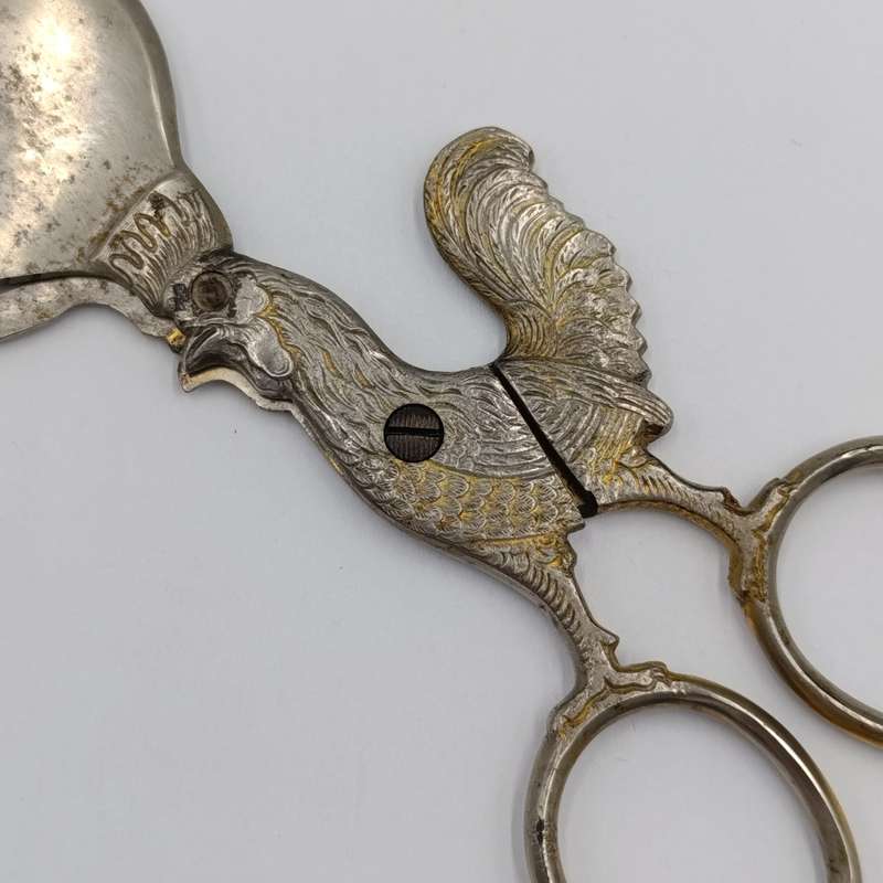 Vintage candle snuffer with rooster