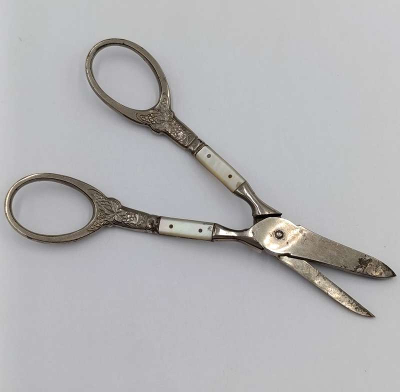 Vintage pair of grape scissors with mother of pearl inserts