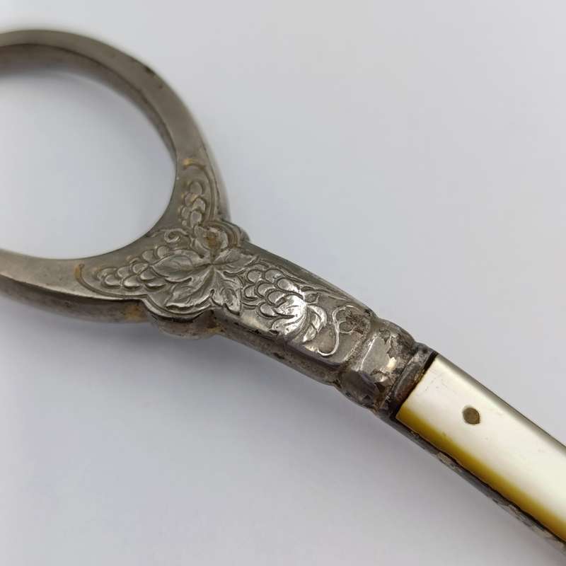 Vintage pair of grape scissors with mother of pearl inserts