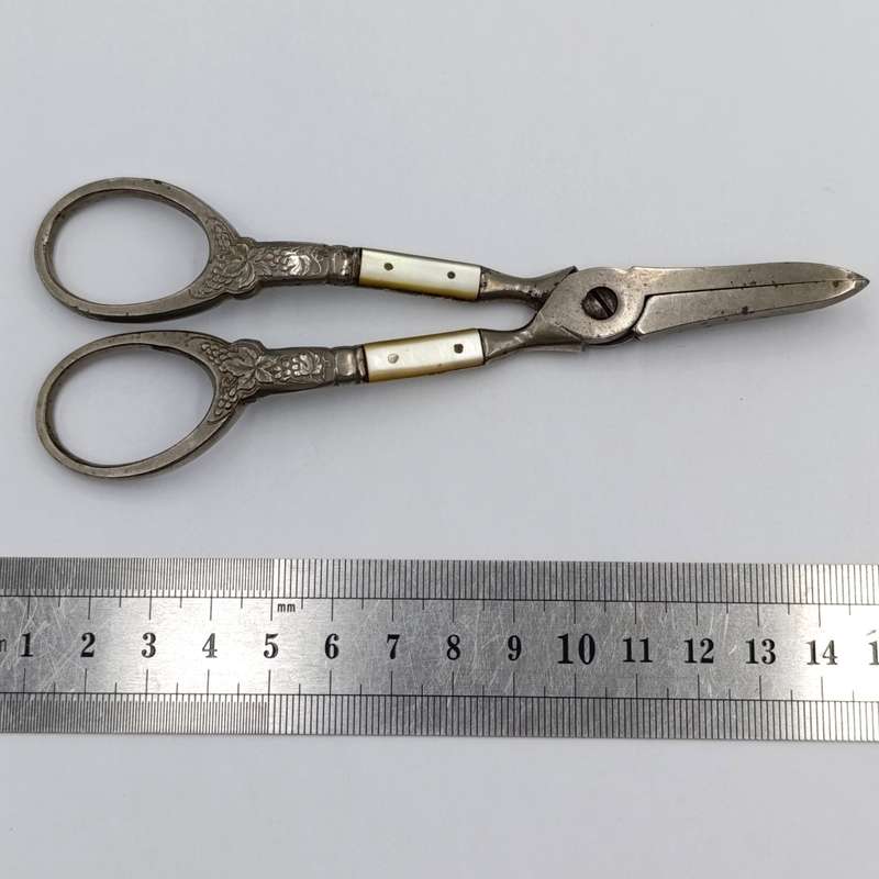 Vintage pair of grape scissors with mother of pearl inserts