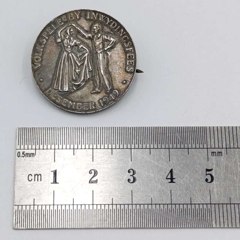 Pair of sterling silver Volkspele brooches plus R10 donation brooch