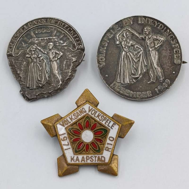 Pair of sterling silver Volkspele brooches plus R10 donation brooch