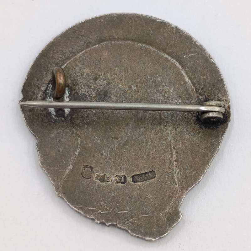 Pair of sterling silver Volkspele brooches plus R10 donation brooch