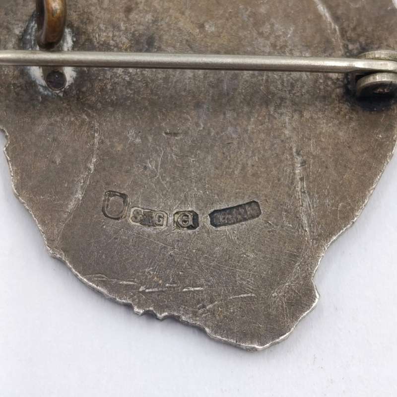 Pair of sterling silver Volkspele brooches plus R10 donation brooch
