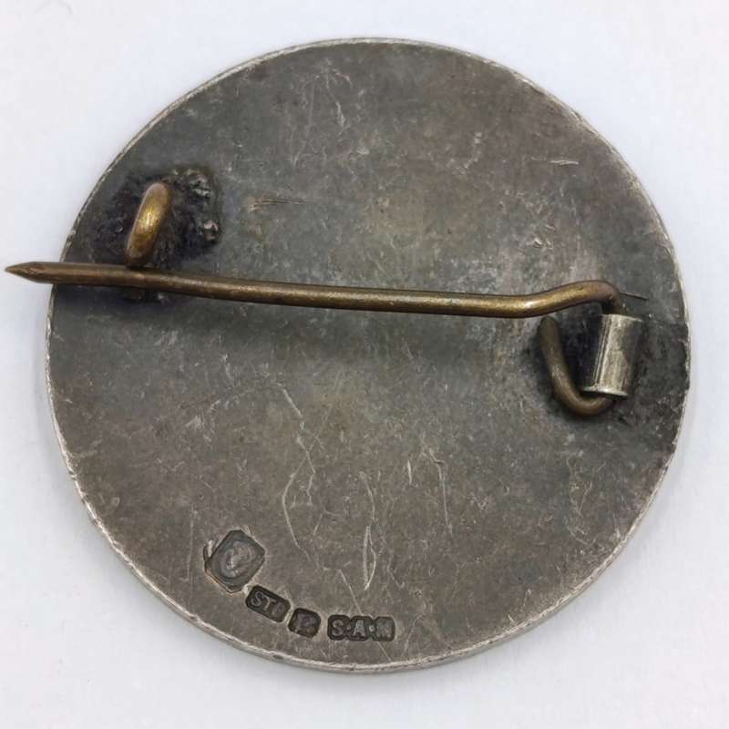Pair of sterling silver Volkspele brooches plus R10 donation brooch