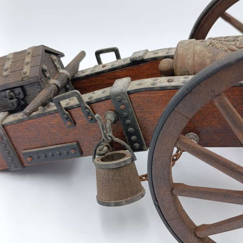 Vintage Napoleon toy cannon model with accessories
